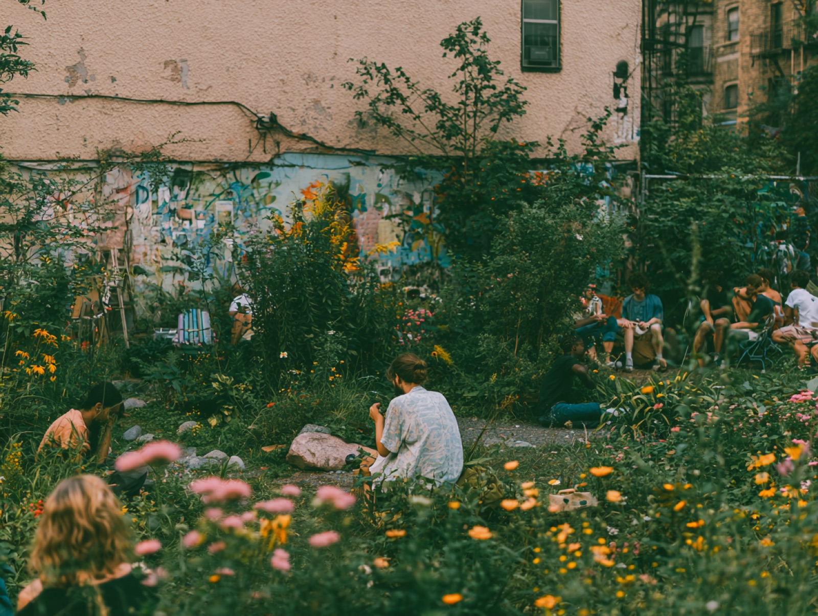 People gathered in a wild urban community garden